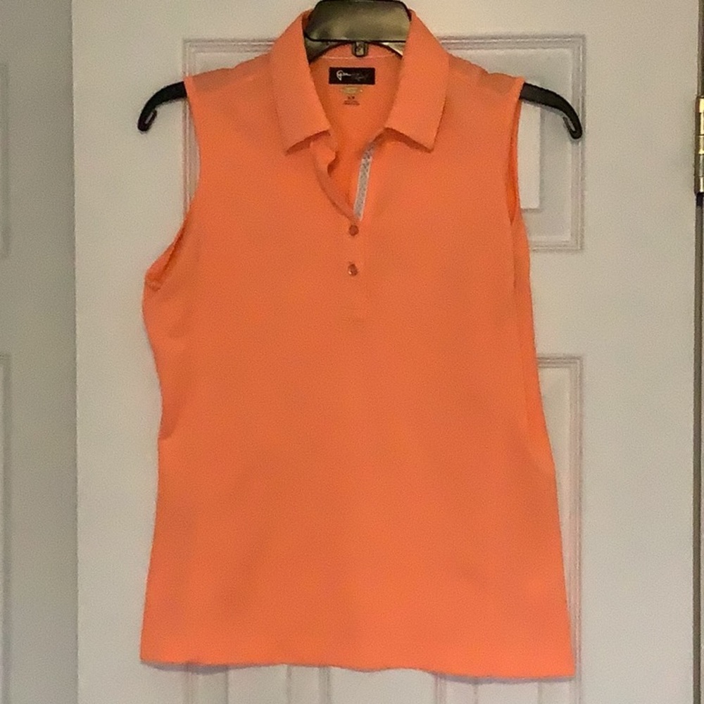 Greg Norman, tangerine colored sleeveless golf shirt, size S